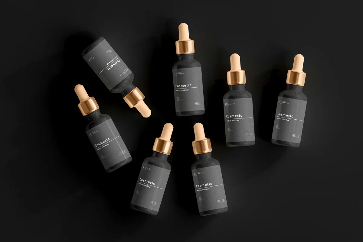 Lima botol serum dengan pipet di atas permukaan hitam